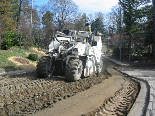Full depth reclamation in progress in Northern Virginia — a reclaimer machine grinding the old asphalt and base into a new compacted foundation
