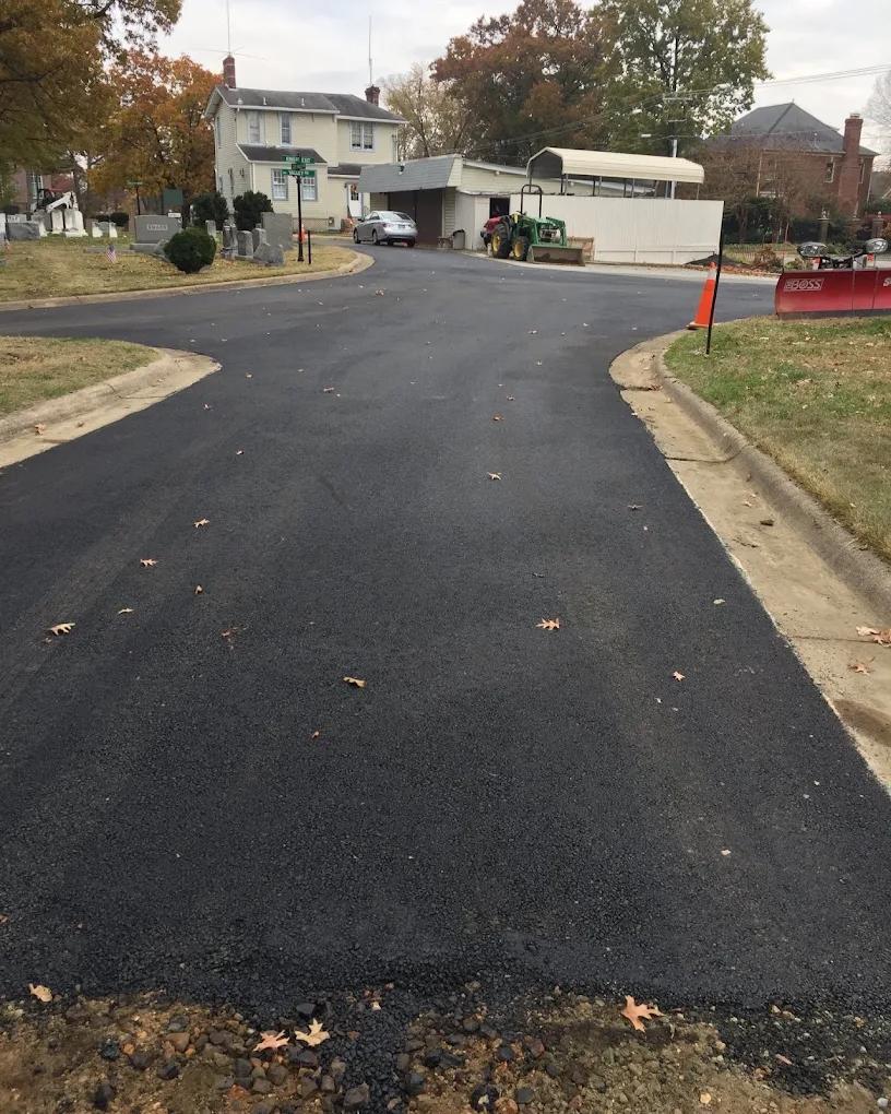Institutional asphalt paving completed on an access road serving a local institutional facility in Northern Virginia