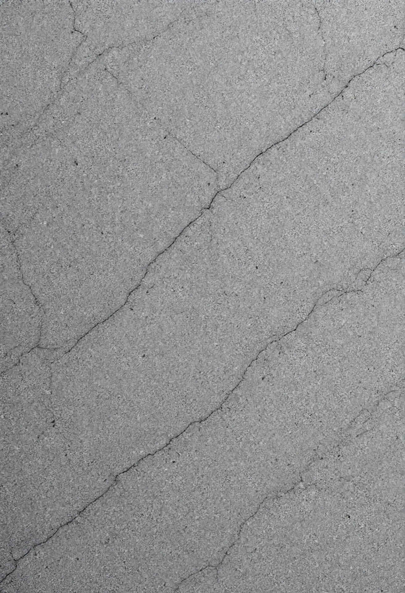 Cracked pavement, the type of reflective cracking a fabric interlayer helps prevent