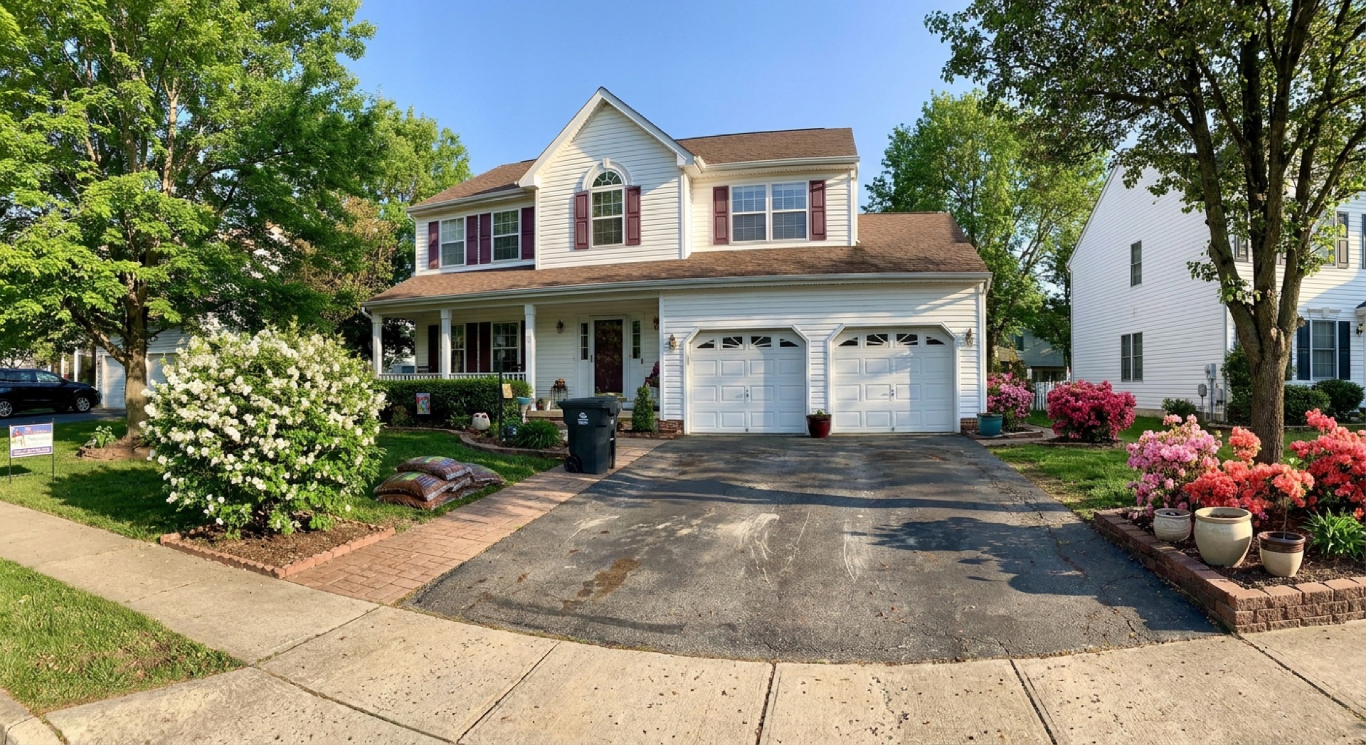 Worn, aging blacktop driveway before full replacement