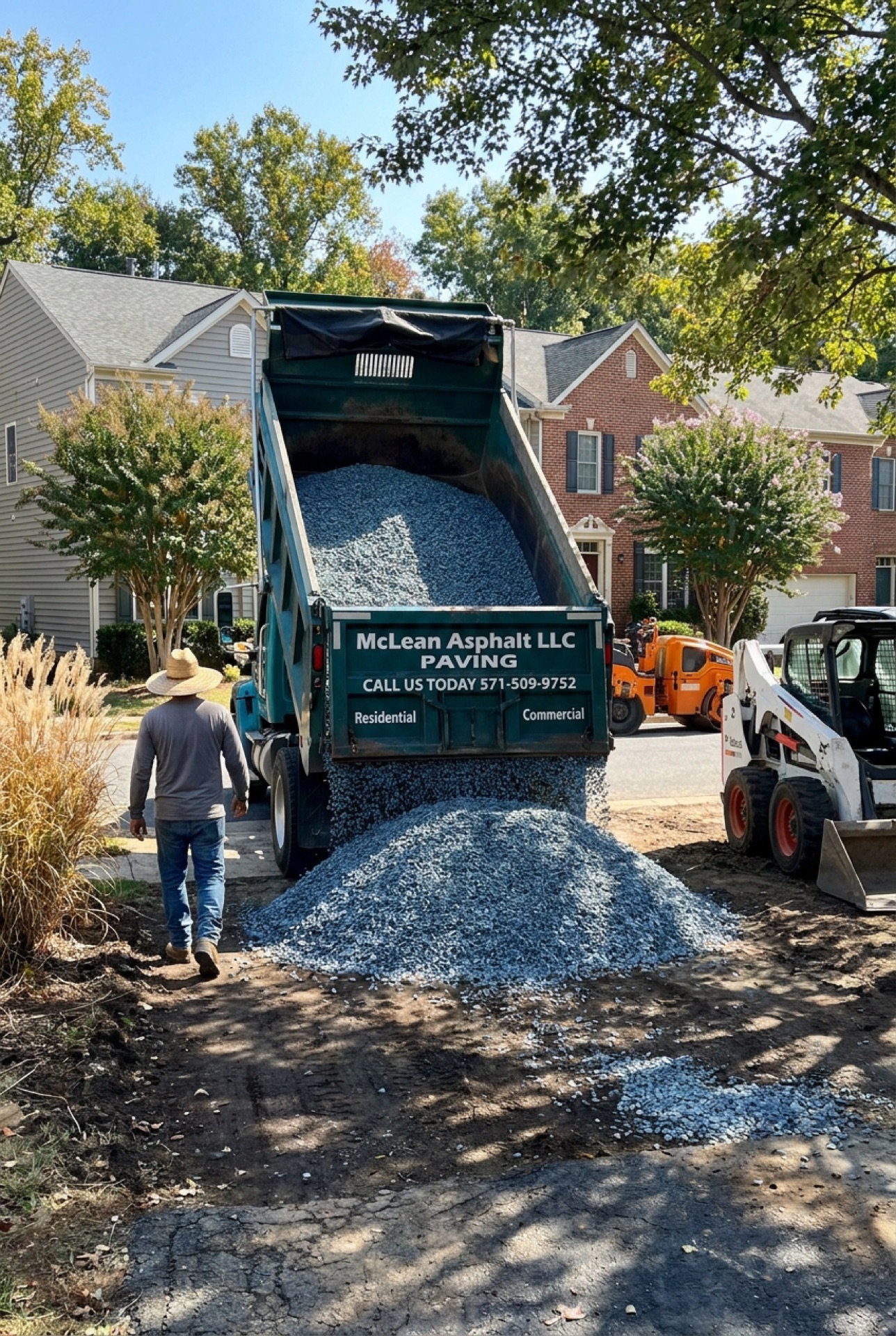 McLean Asphalt truck delivering base material for residential driveway
