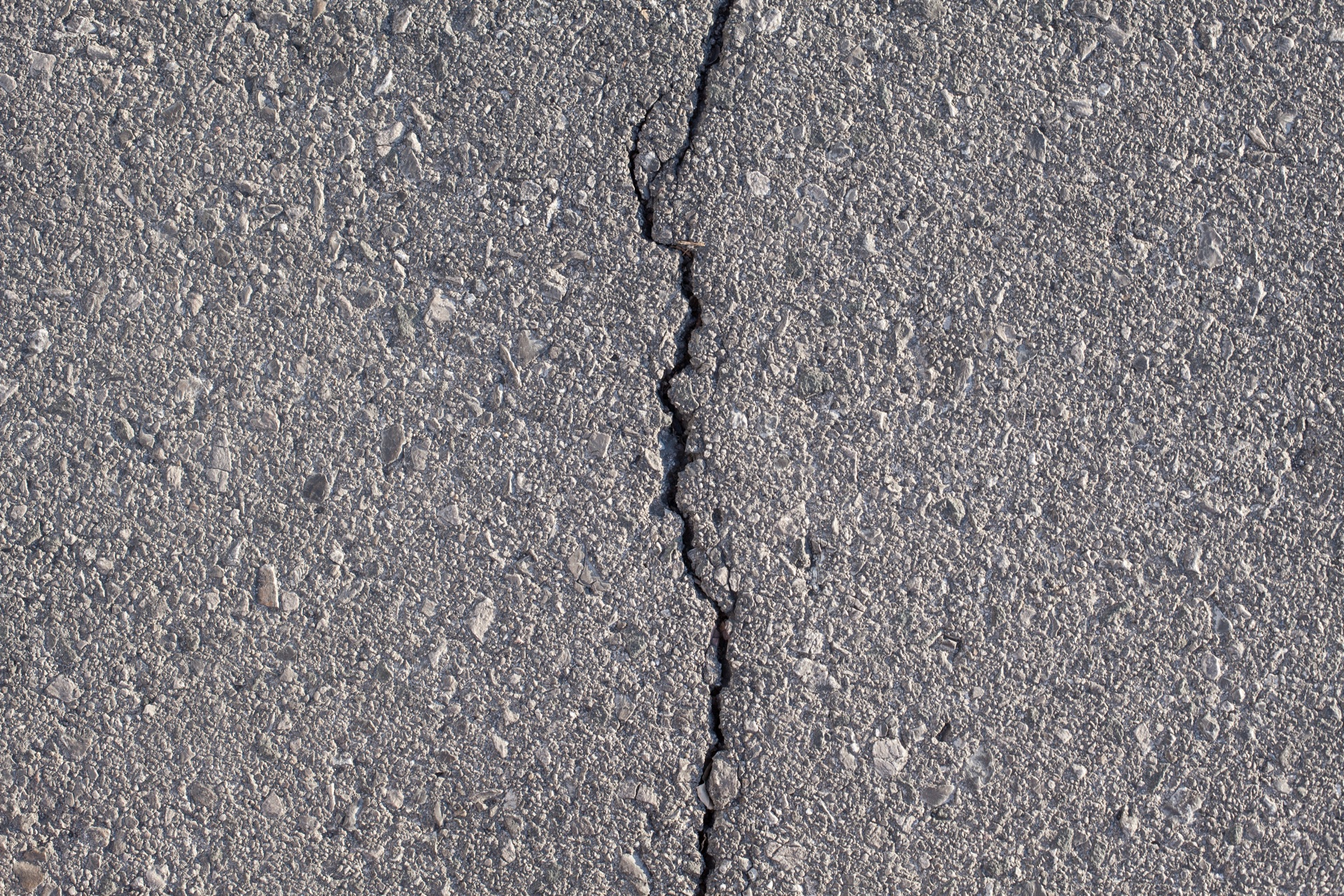 Asphalt crack fissure closeup McLean VA