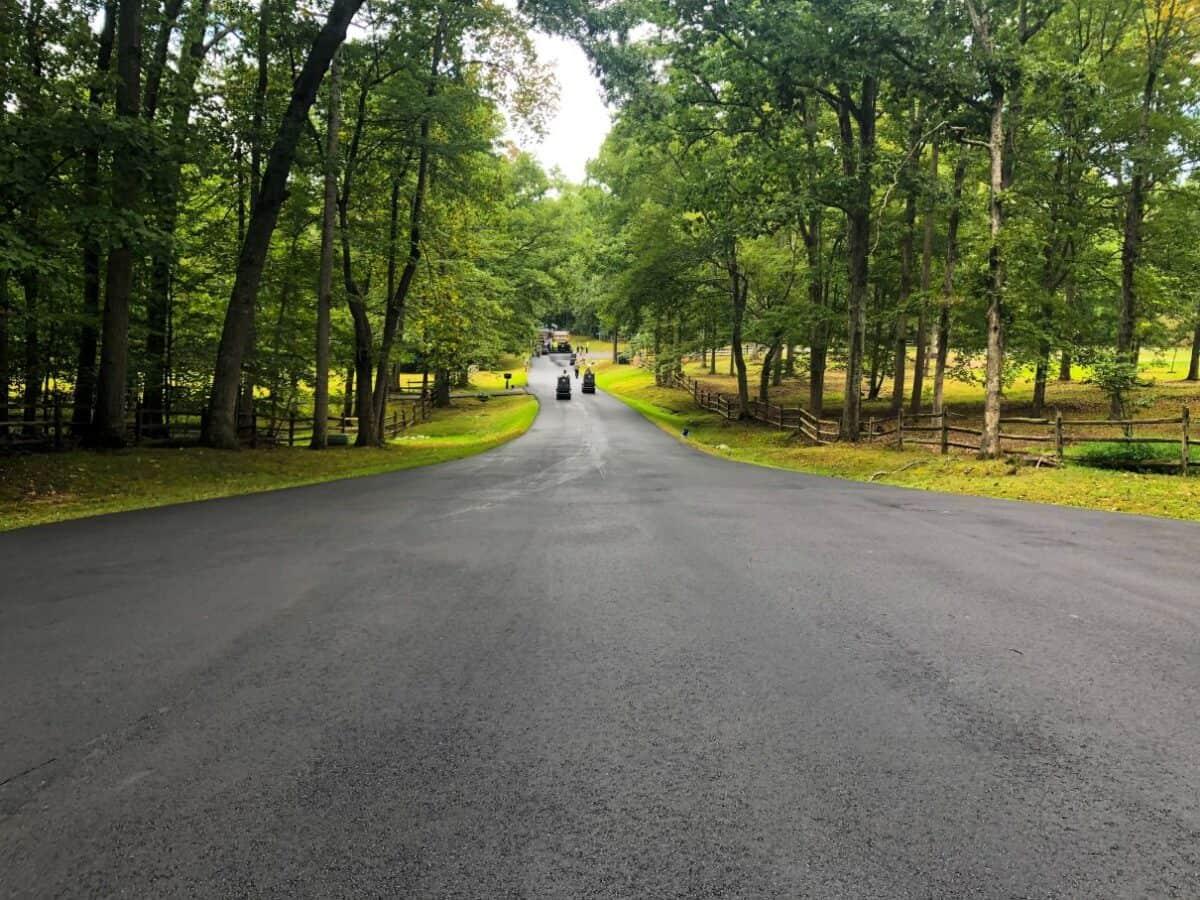 Private road paving completed on a tree-lined estate road in Northern Virginia